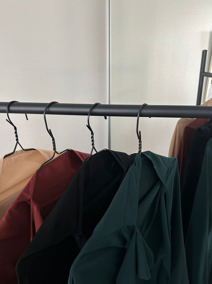 Close-up view of Layla Khimar Sets in a range of colors, including Autumn Ember, Midnight Calm, Soft Camel, and Deep Pine, highlighting the smooth drape and elegant, single-layer fabric by Lipes Modest Wear.