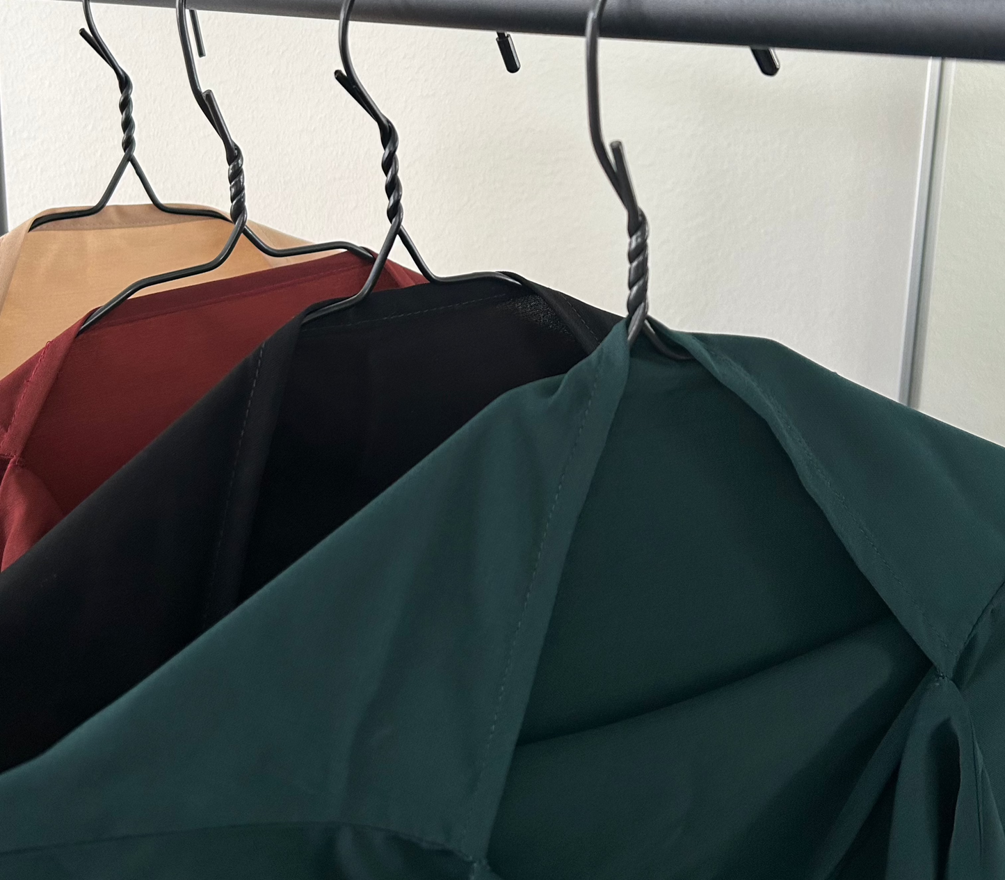 Close-up view of Layla Khimar Sets in various colors, including Deep Pine, Midnight Calm, Autumn Ember, and Soft Camel, showcasing the rich tones and lightweight, single-layer fabric by Lipes Modest Wear.