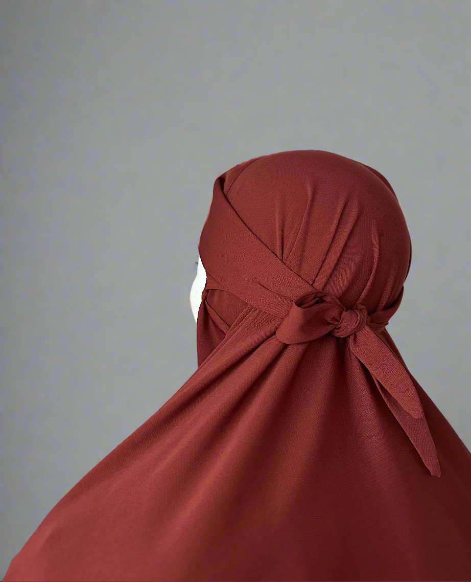 Back view of Autumn Ember Layla Khimar by Lipes Modest Wear on a mannequin, highlighting the elegant, full-coverage design and rich, warm tone.