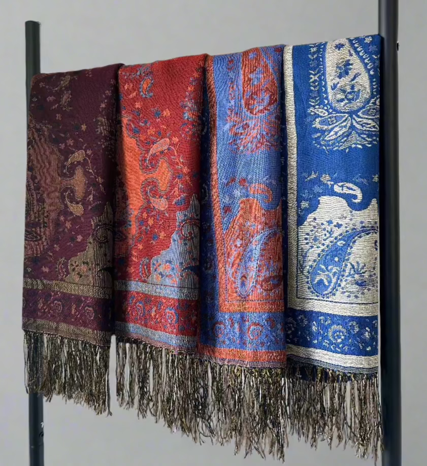 Lula Scarves in Blue Ocean, Blue Flame, Red Flame, and Deep Plum - a collection of vibrant and rich colors, showcasing the soft and luxurious feel of each scarf. Perfect for adding a touch of elegance and color to any wardrobe.